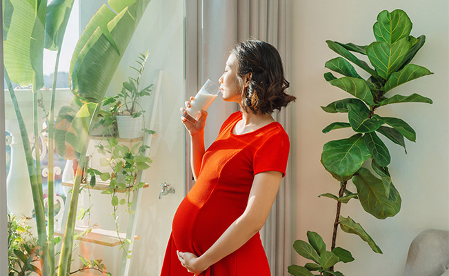 Prenatal vitamins:  Pregnant mom drinking milk