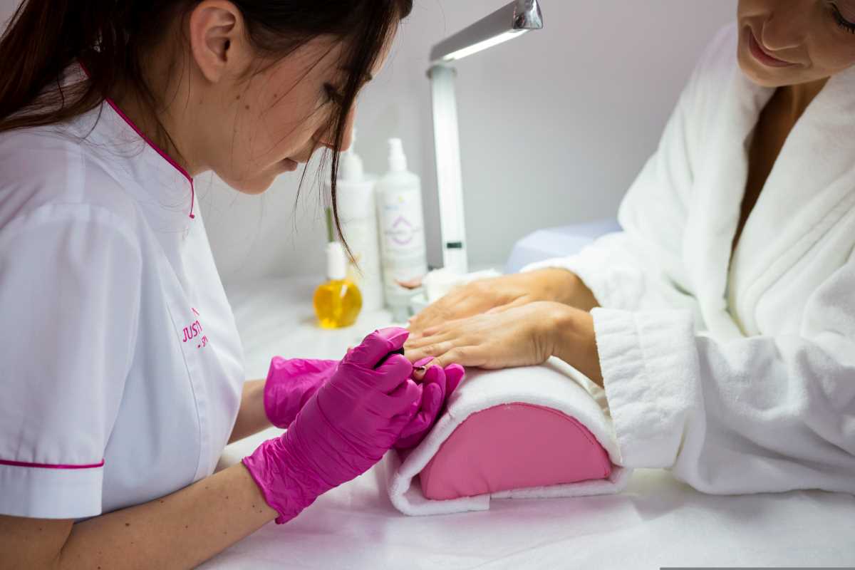 Mom enjoying manicure as part of her postpartum wellness self-care